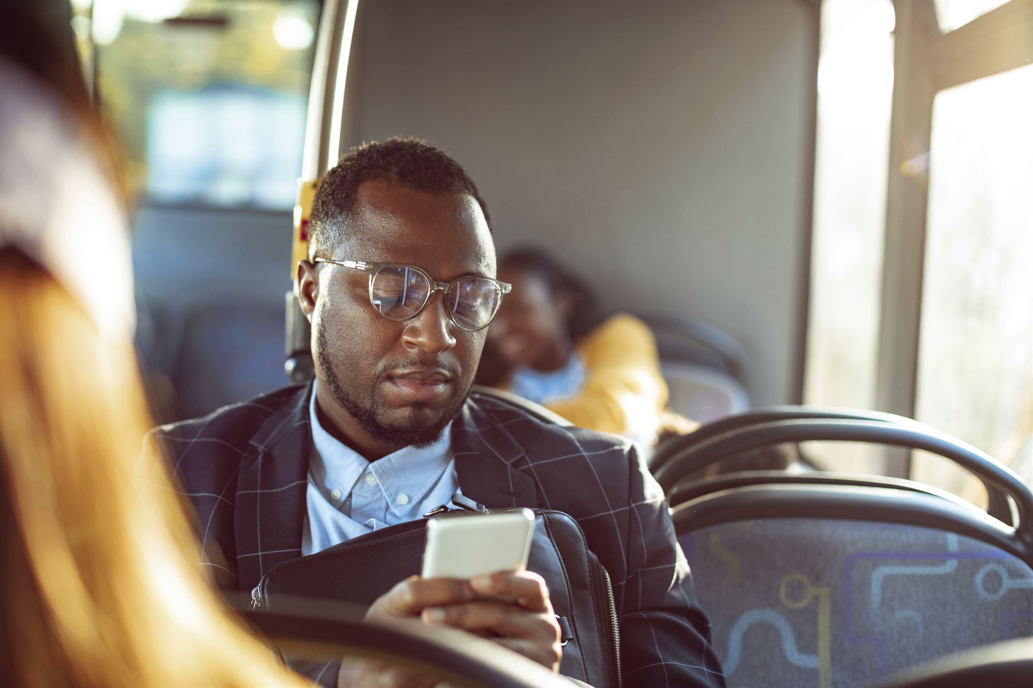 Bus driver assisting passenger