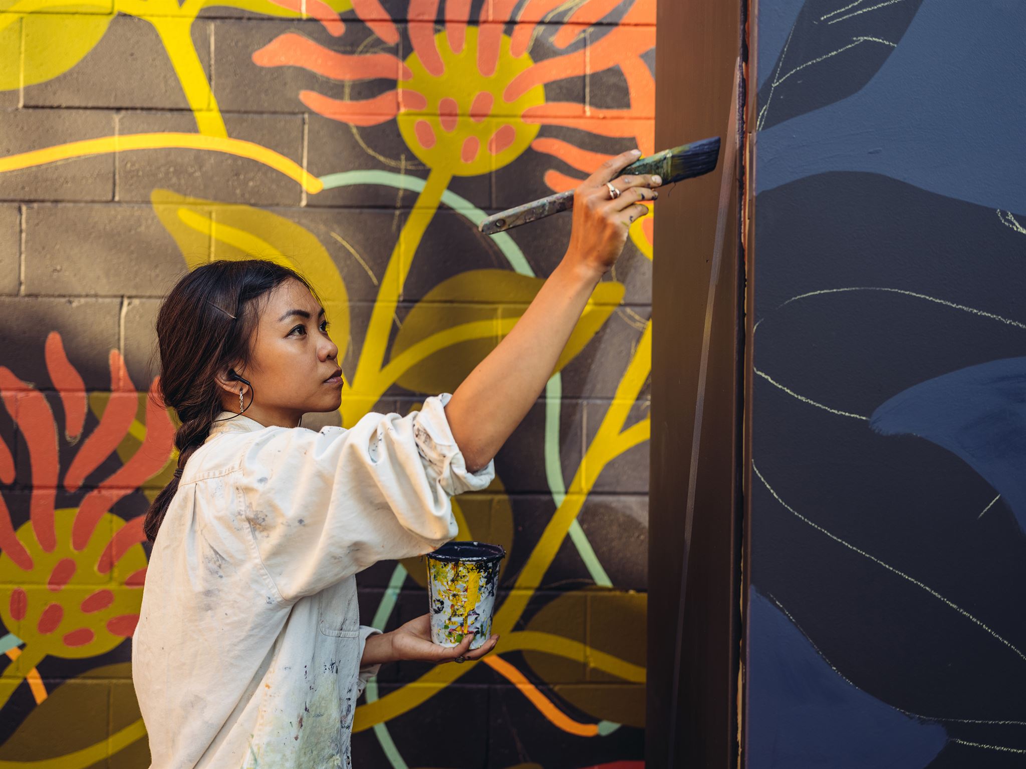Artist painting colorful mural