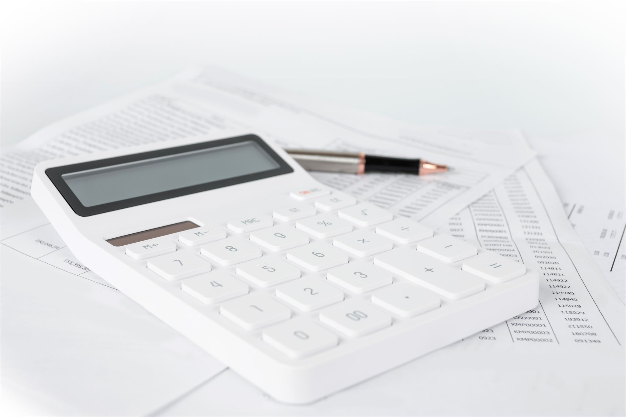 Calculator and tax forms on desk