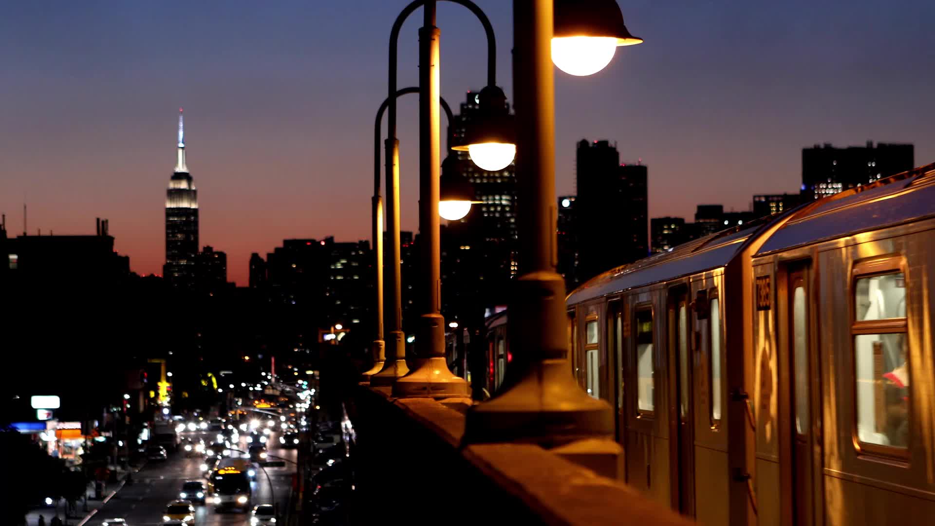 City worker fixing streetlight at dusk