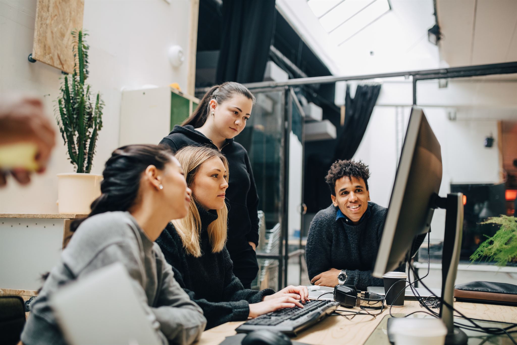 Women collaborating in technology workspace