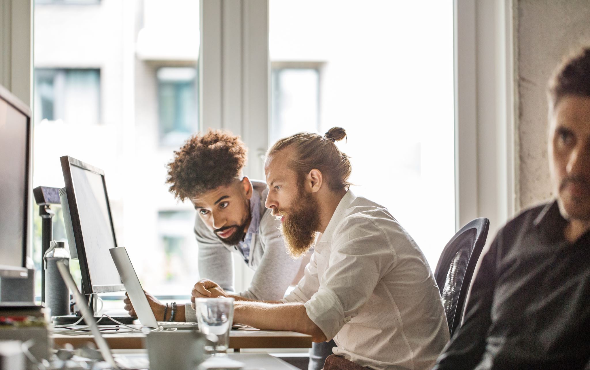 Team collaboration on laptop