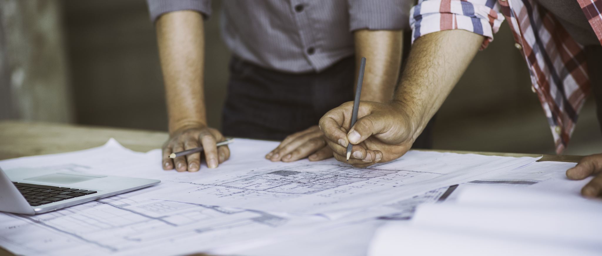 Engineer reviewing technical drawings