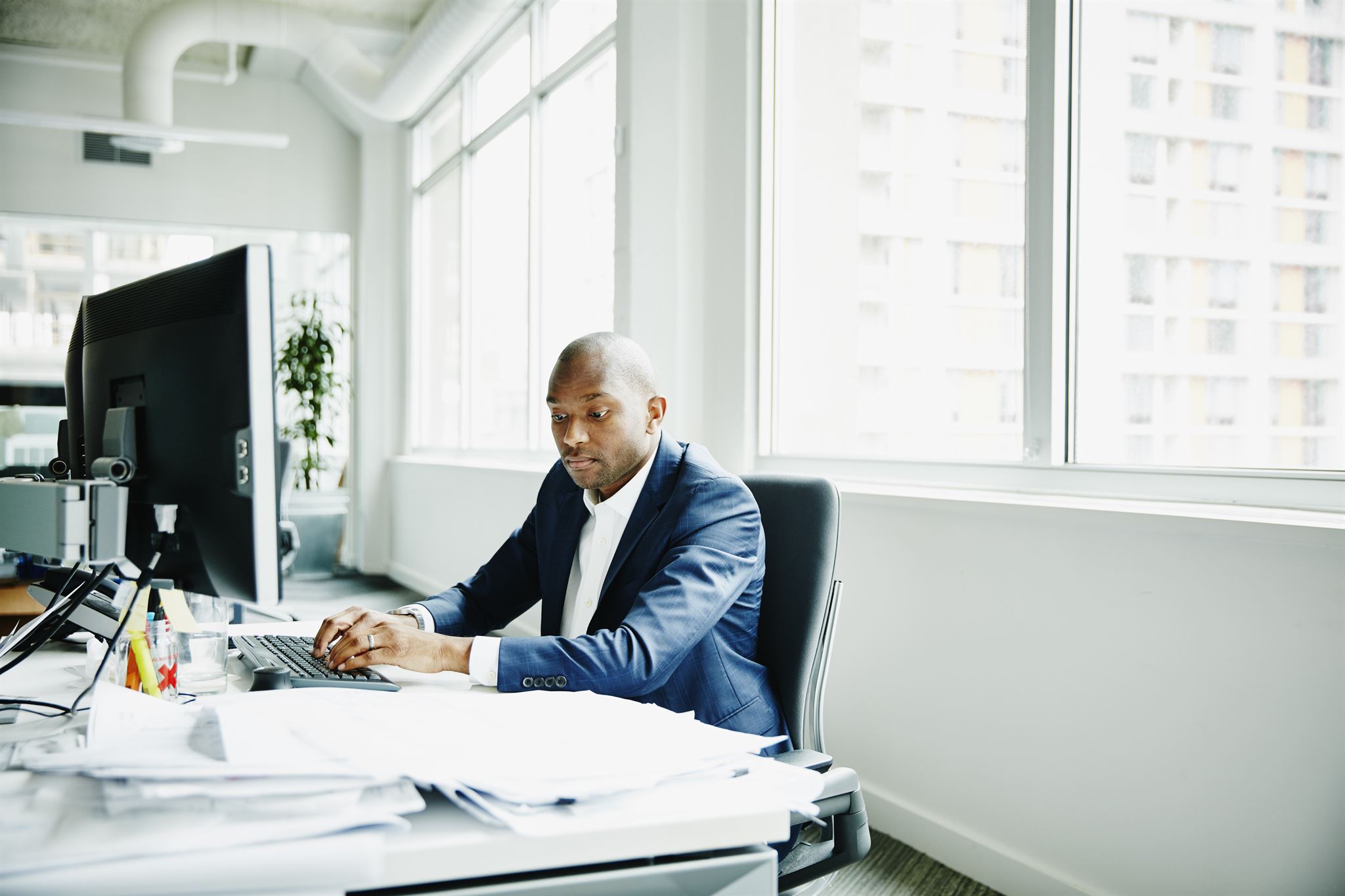 Job seeker reviewing job listings on laptop