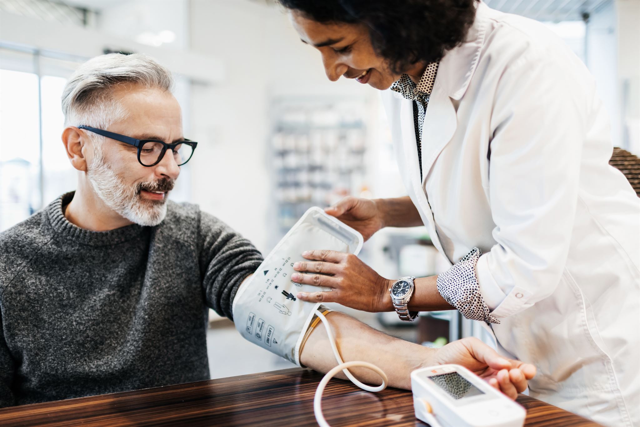 Customer receiving eyeglasses at retail store