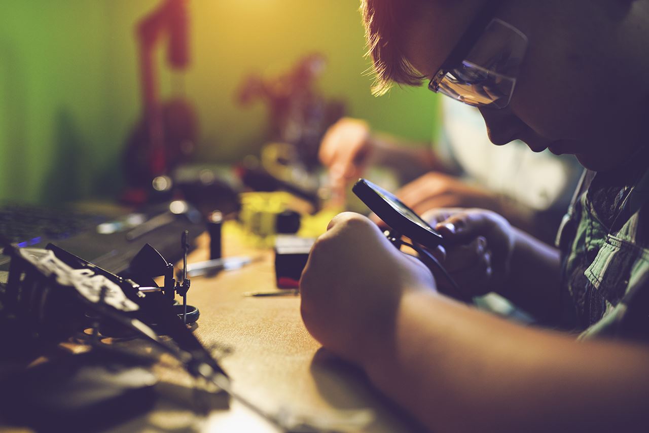 Equipment operator checking repair status on mobile device