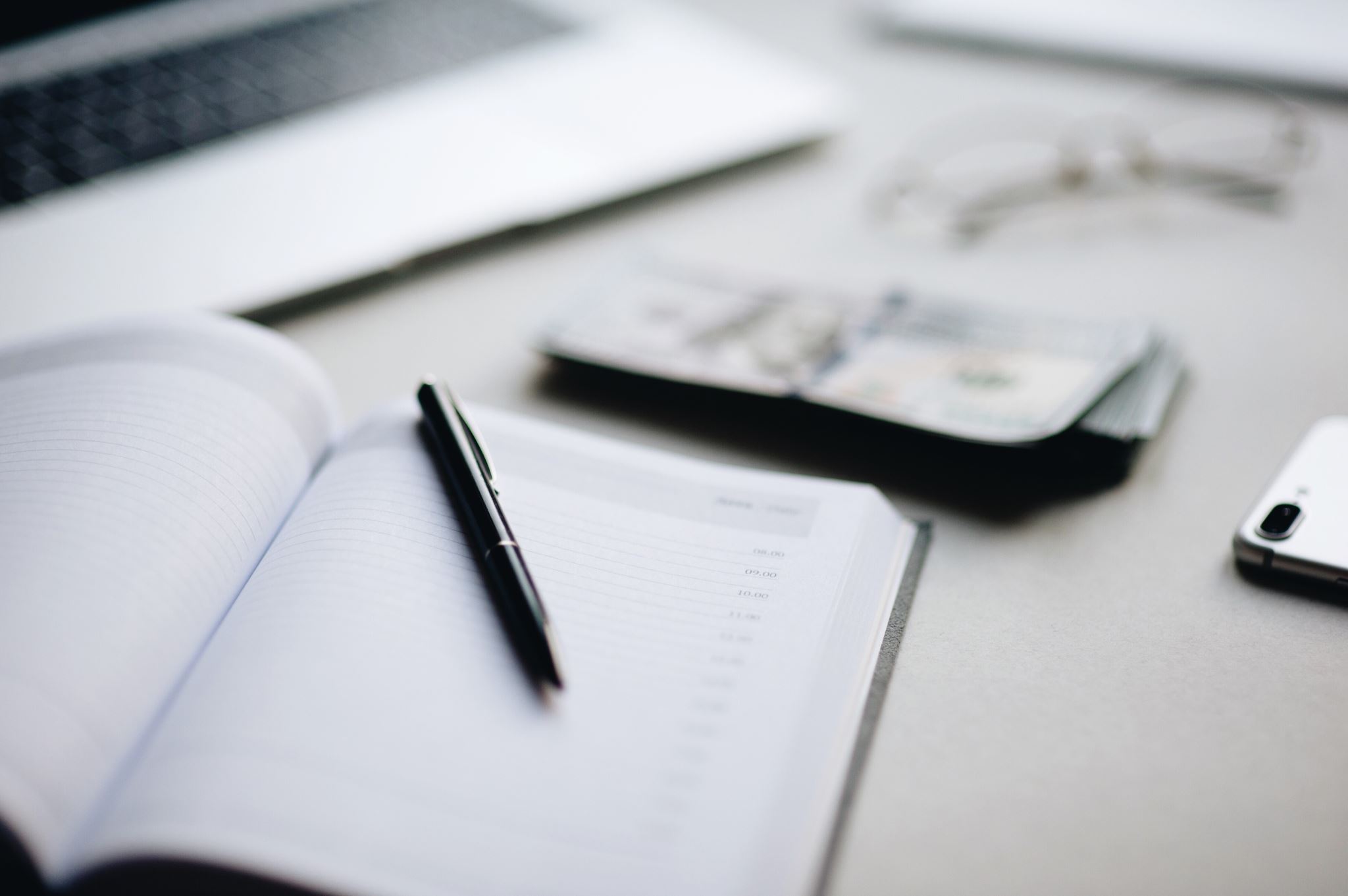 Payroll documents and laptop