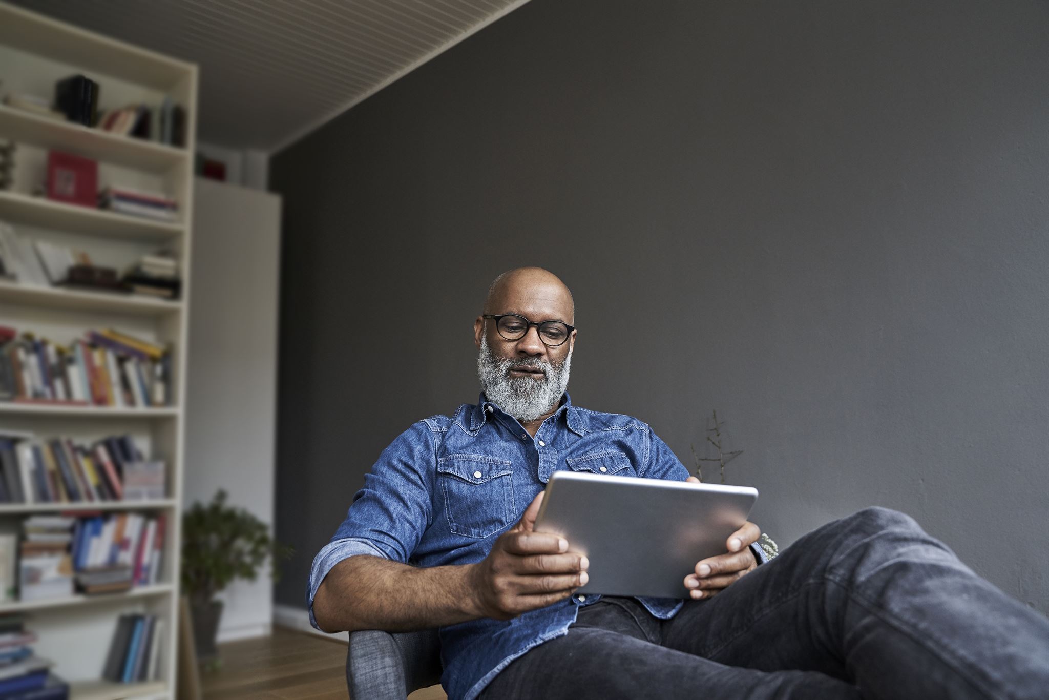 Smiling person using chat on tablet