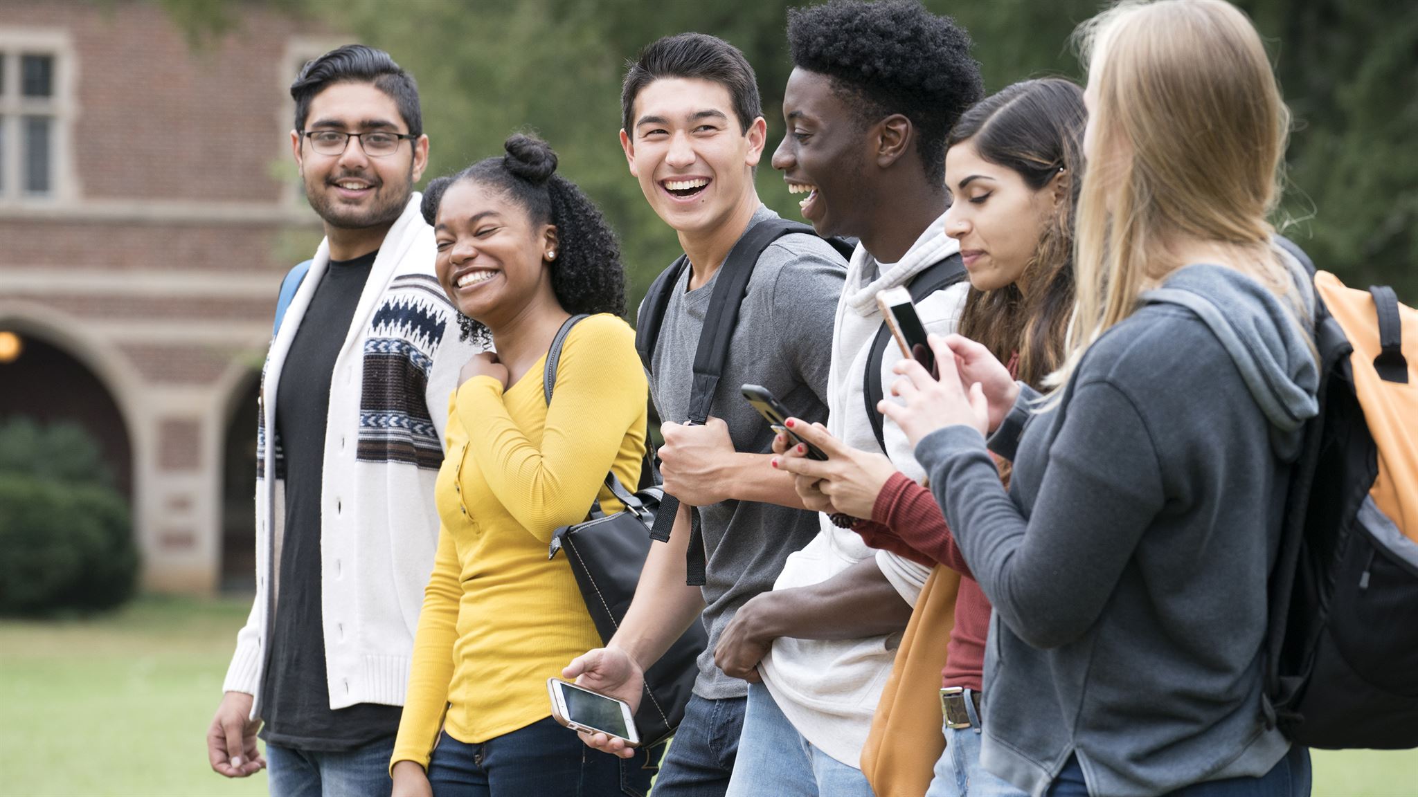 Happy diverse students on campus