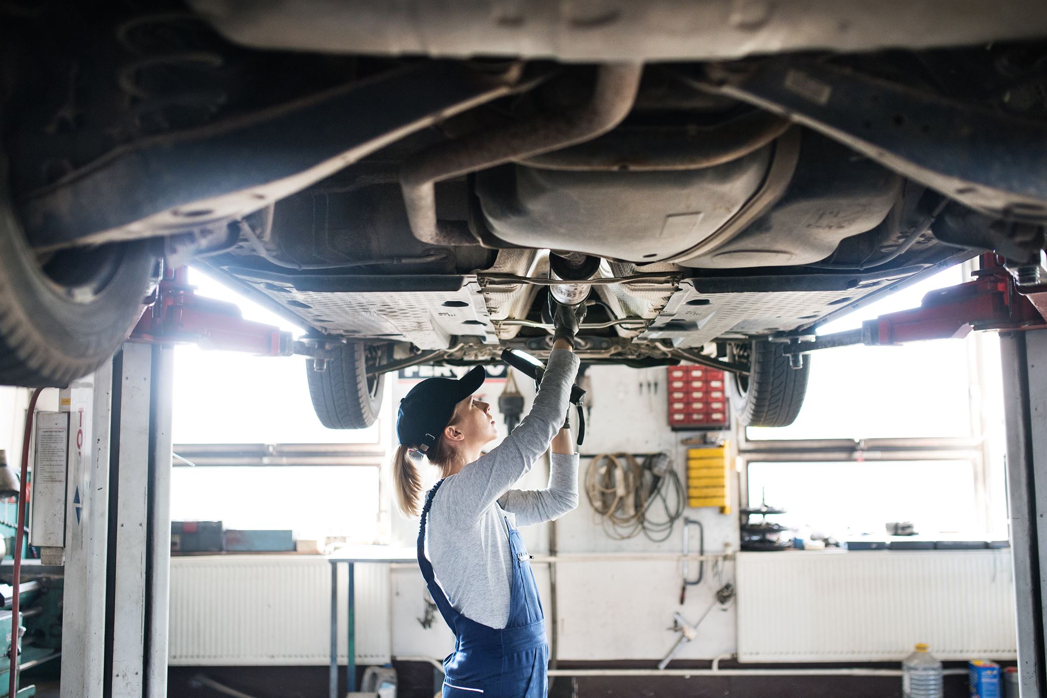 Car mechanic assisting a customer
