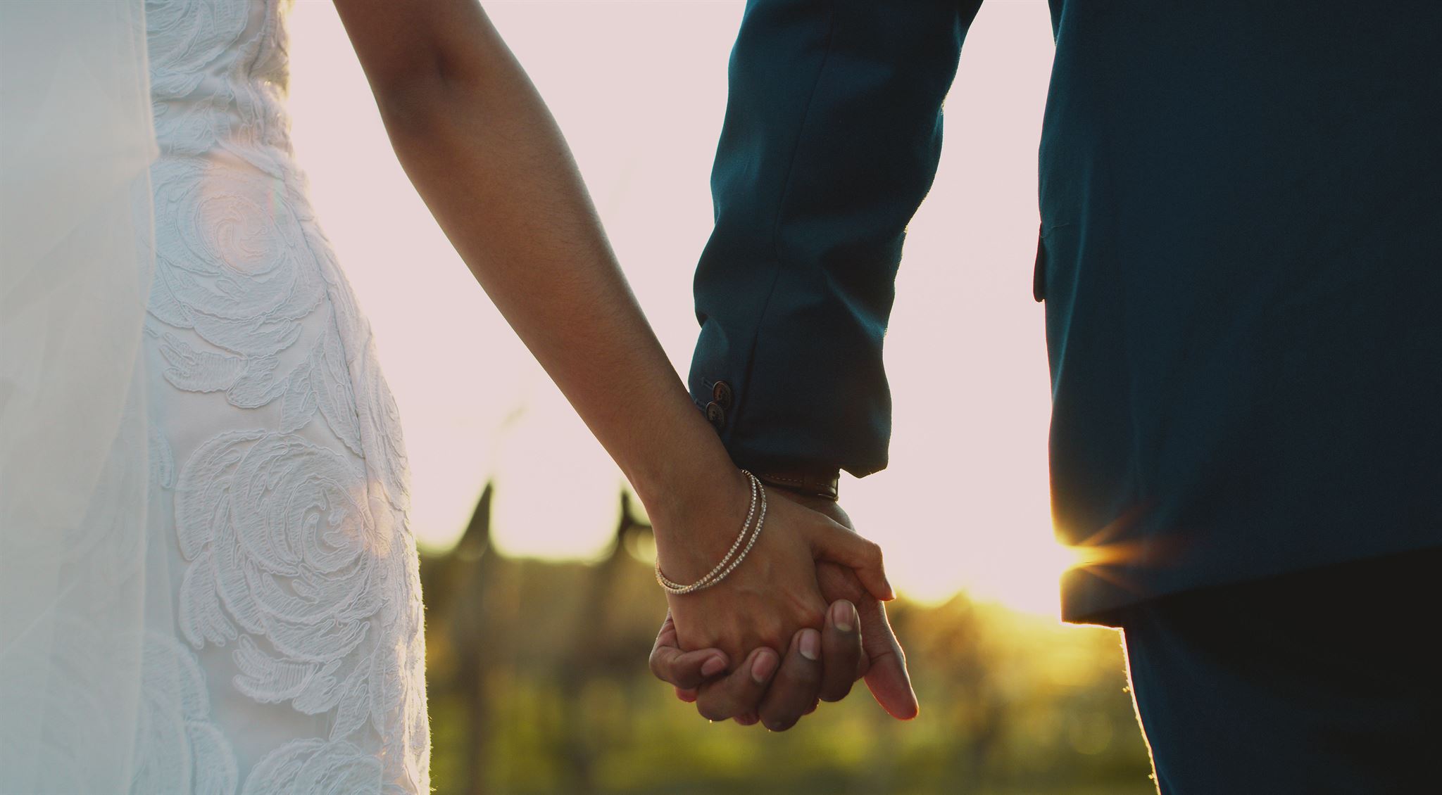 Nick and Andria holding hands