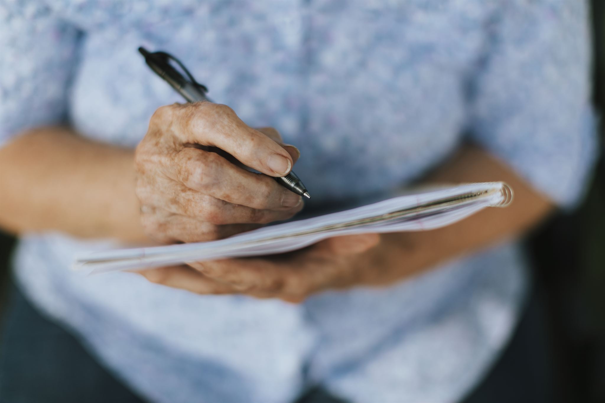 Person reviewing documents with pen