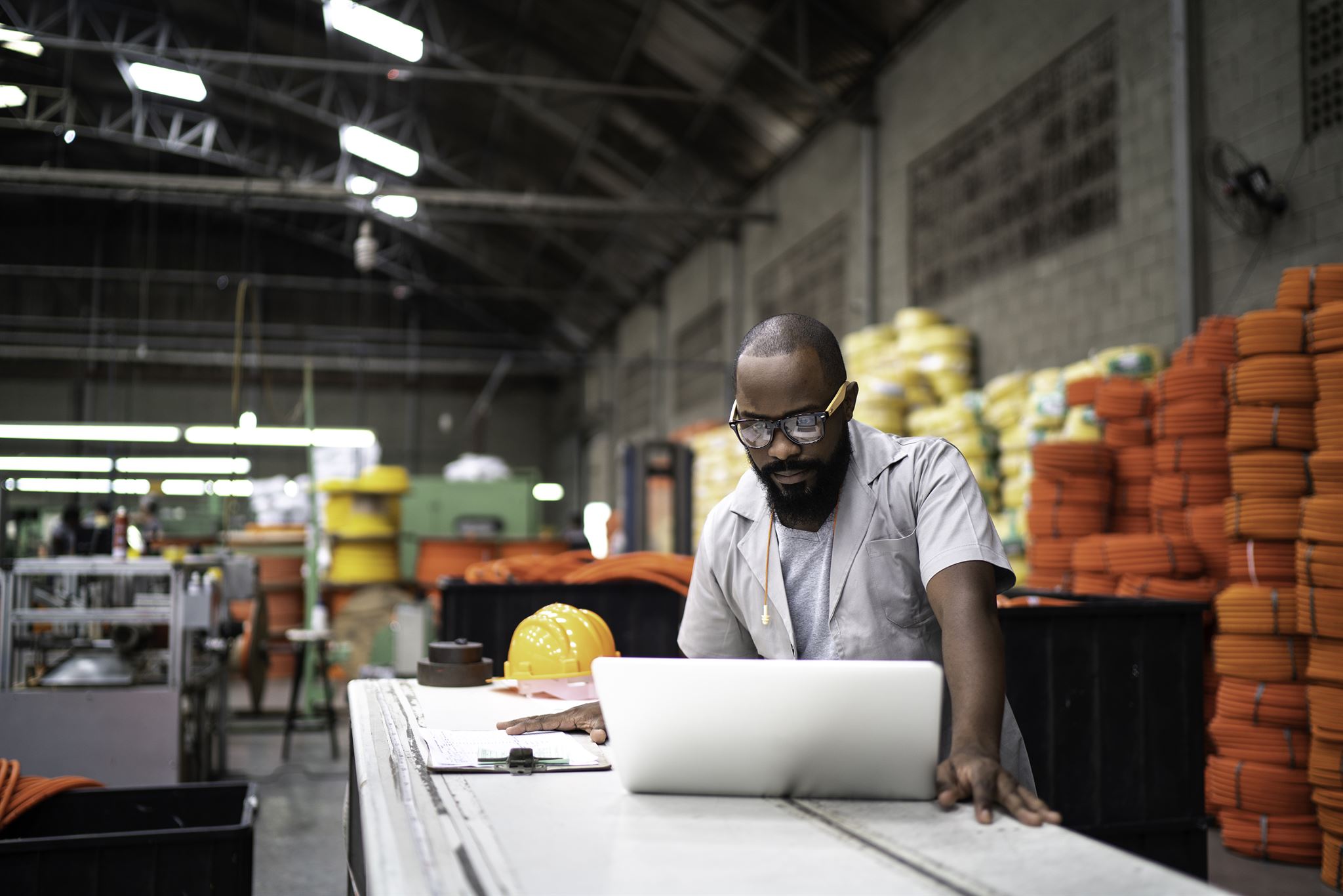Customer reviewing manufacturing estimates on laptop