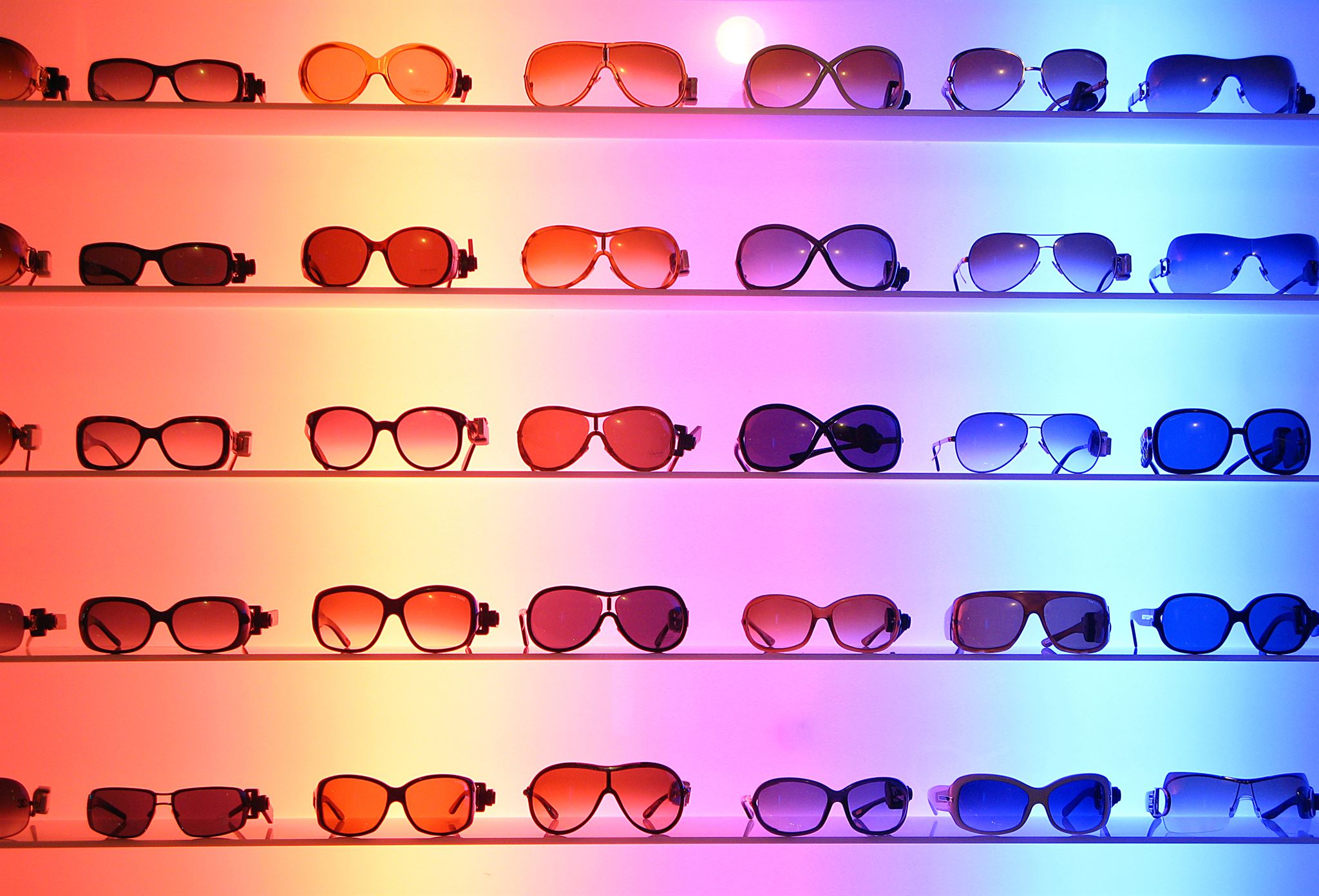 Glasses displayed on store shelves with price tags