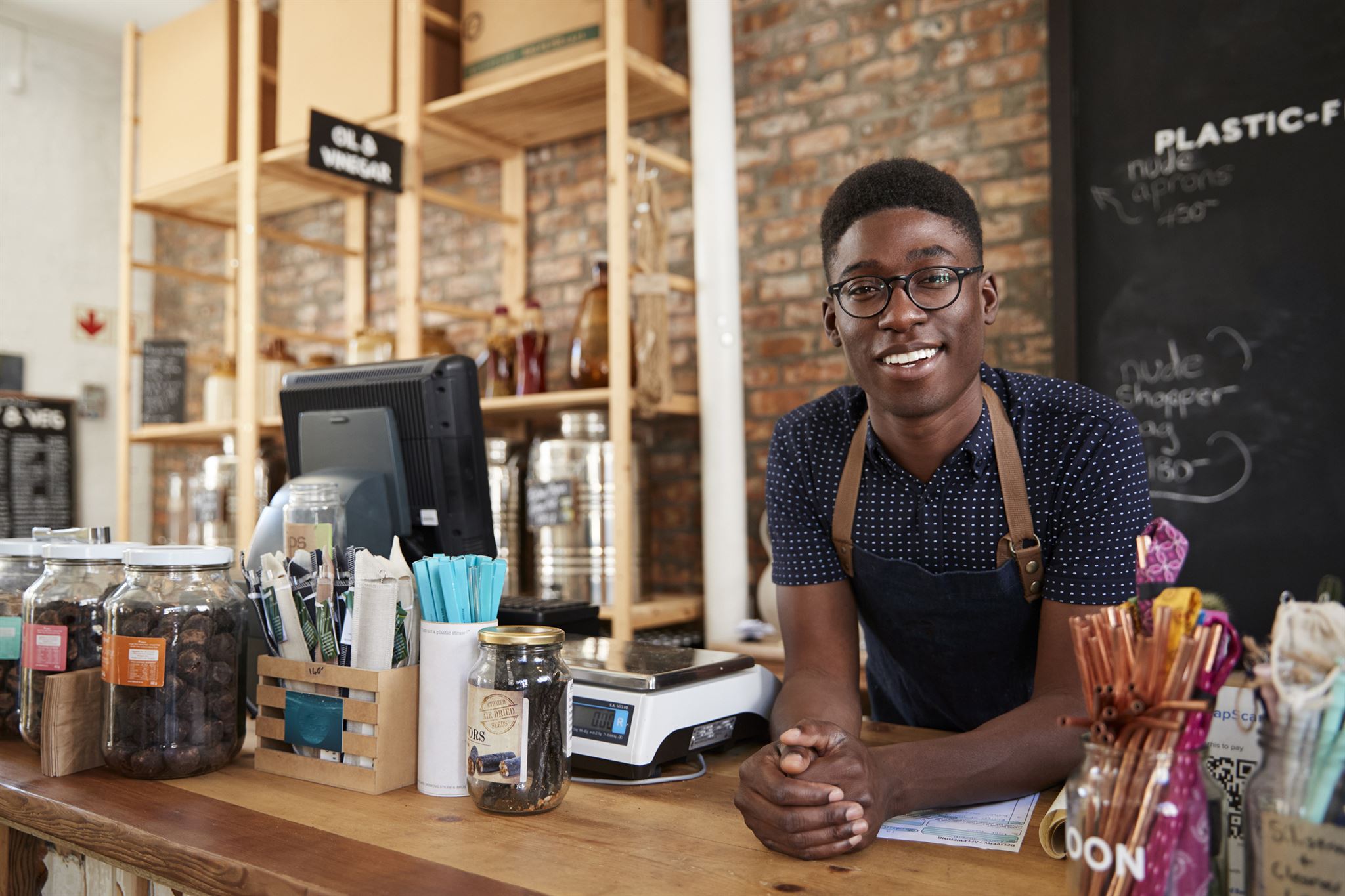 Customer using loyalty card at cafe counter