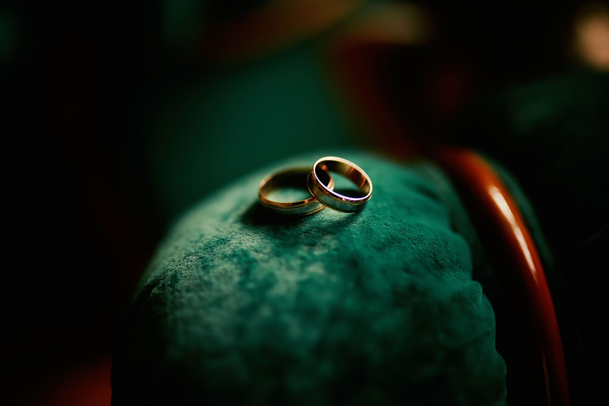 Wedding rings resting on a mountain rock