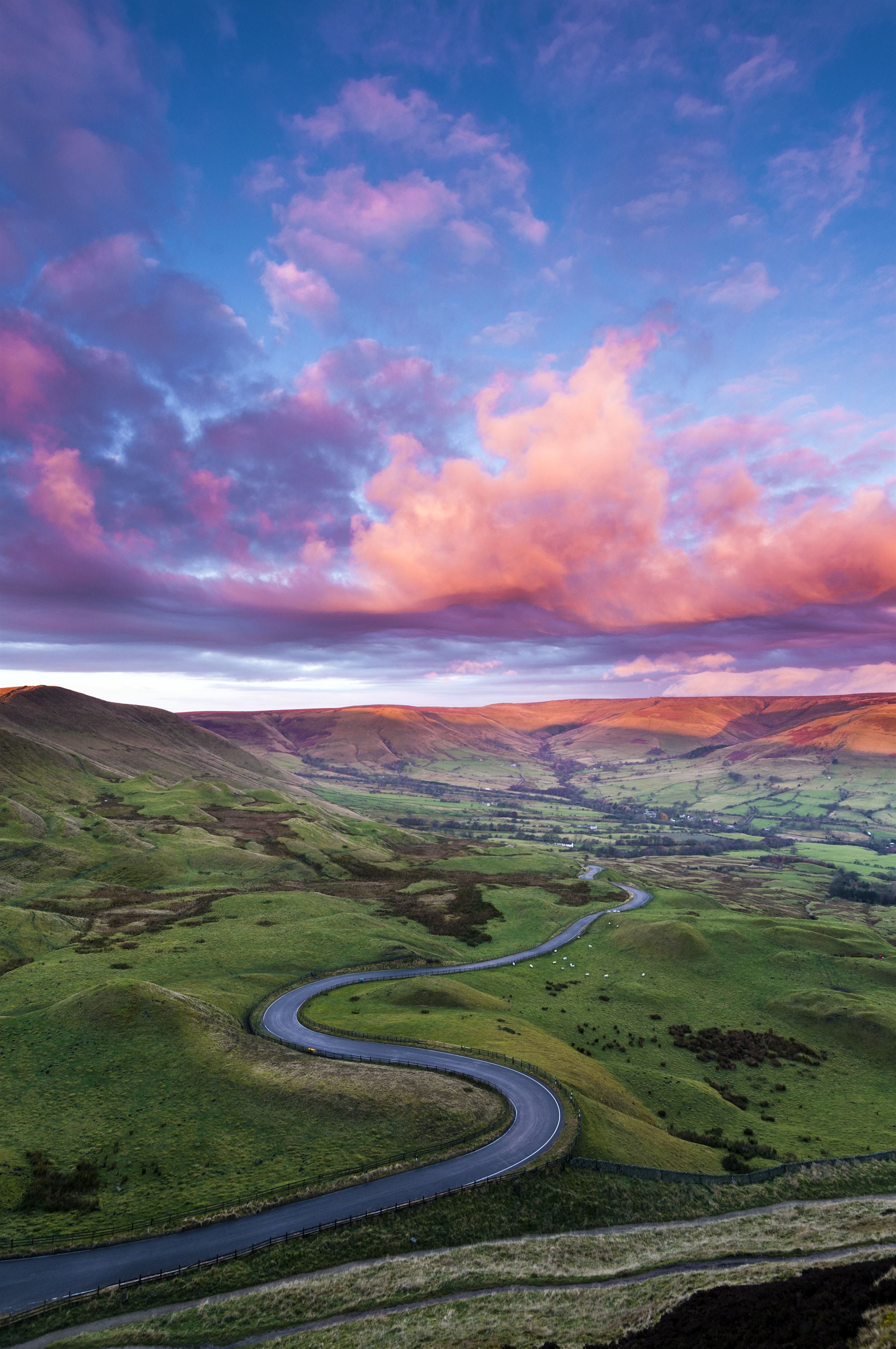Calm river flowing through green valley
