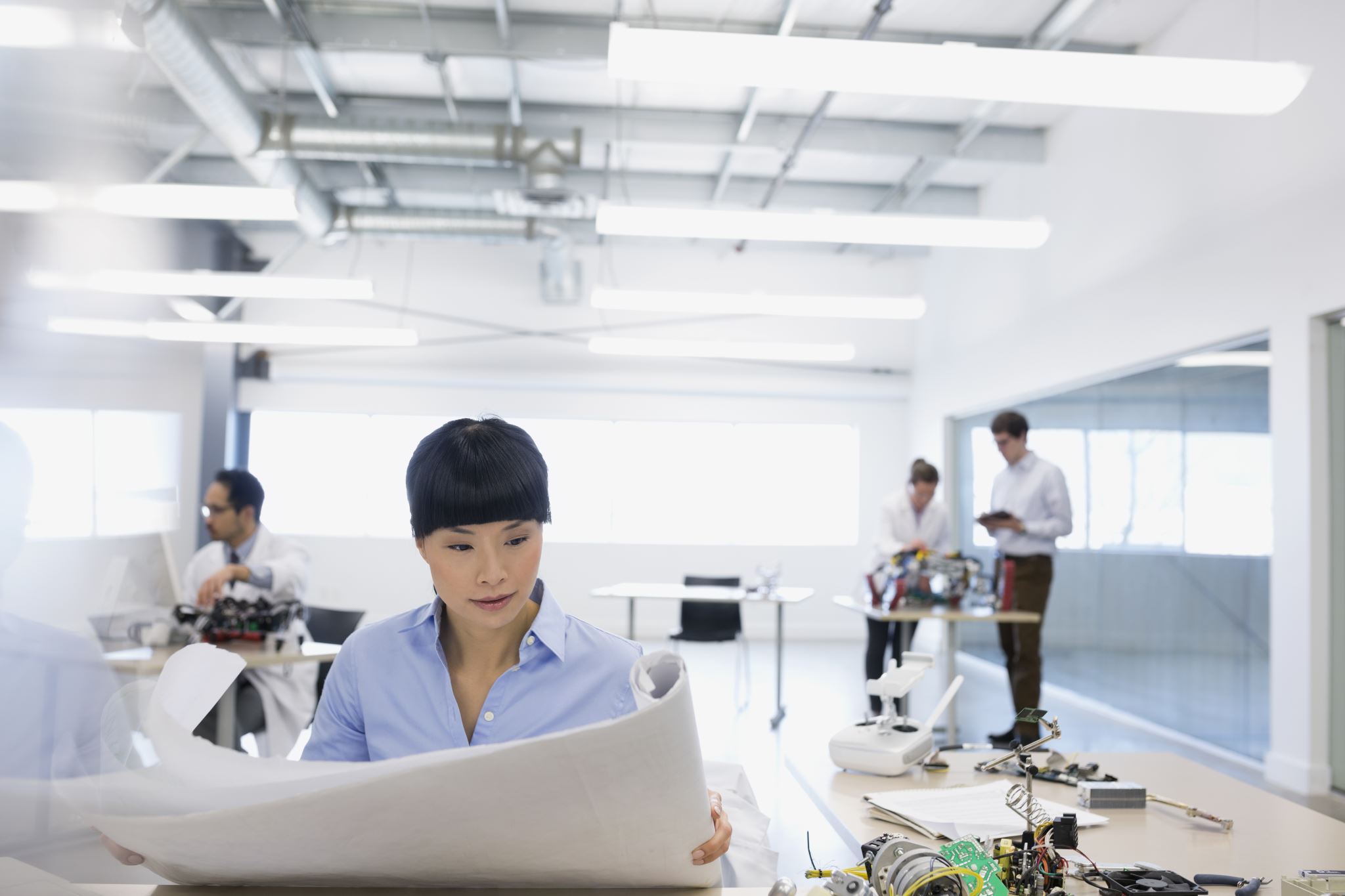 engineers collaborating on technology design