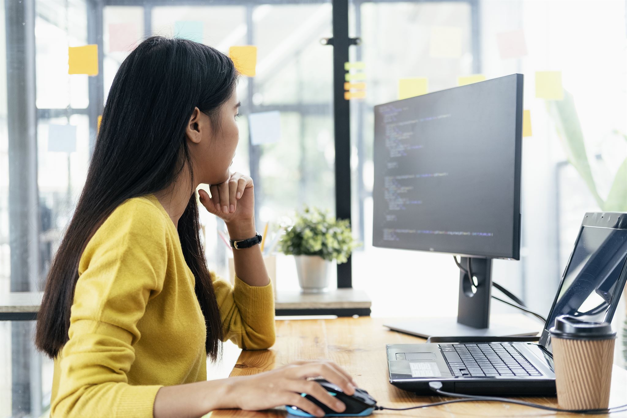 Recruiter reviewing applications on computer screen