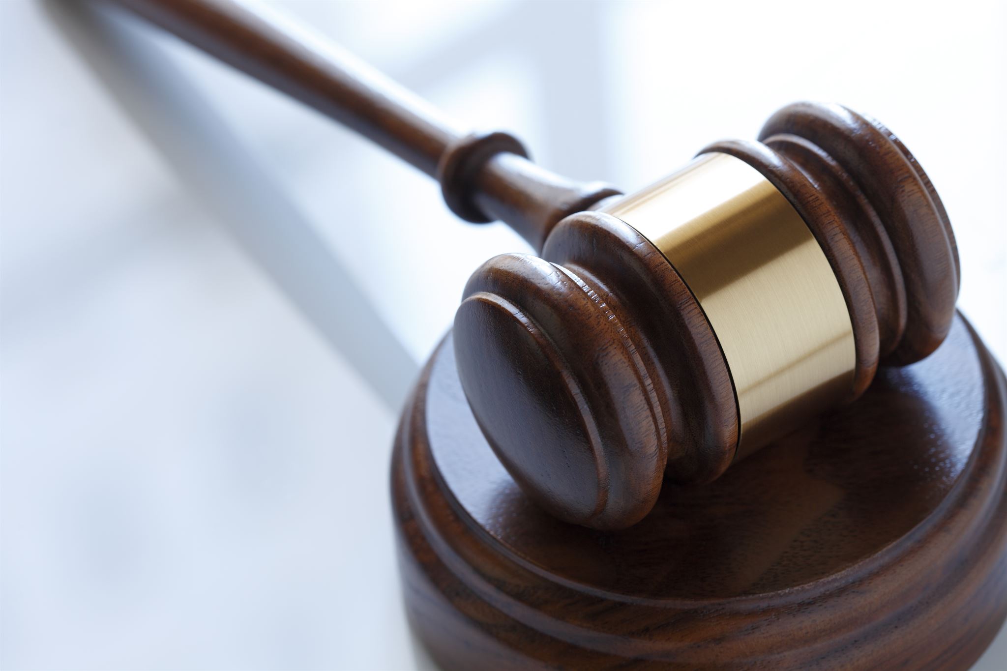 Law book and gavel on desk
