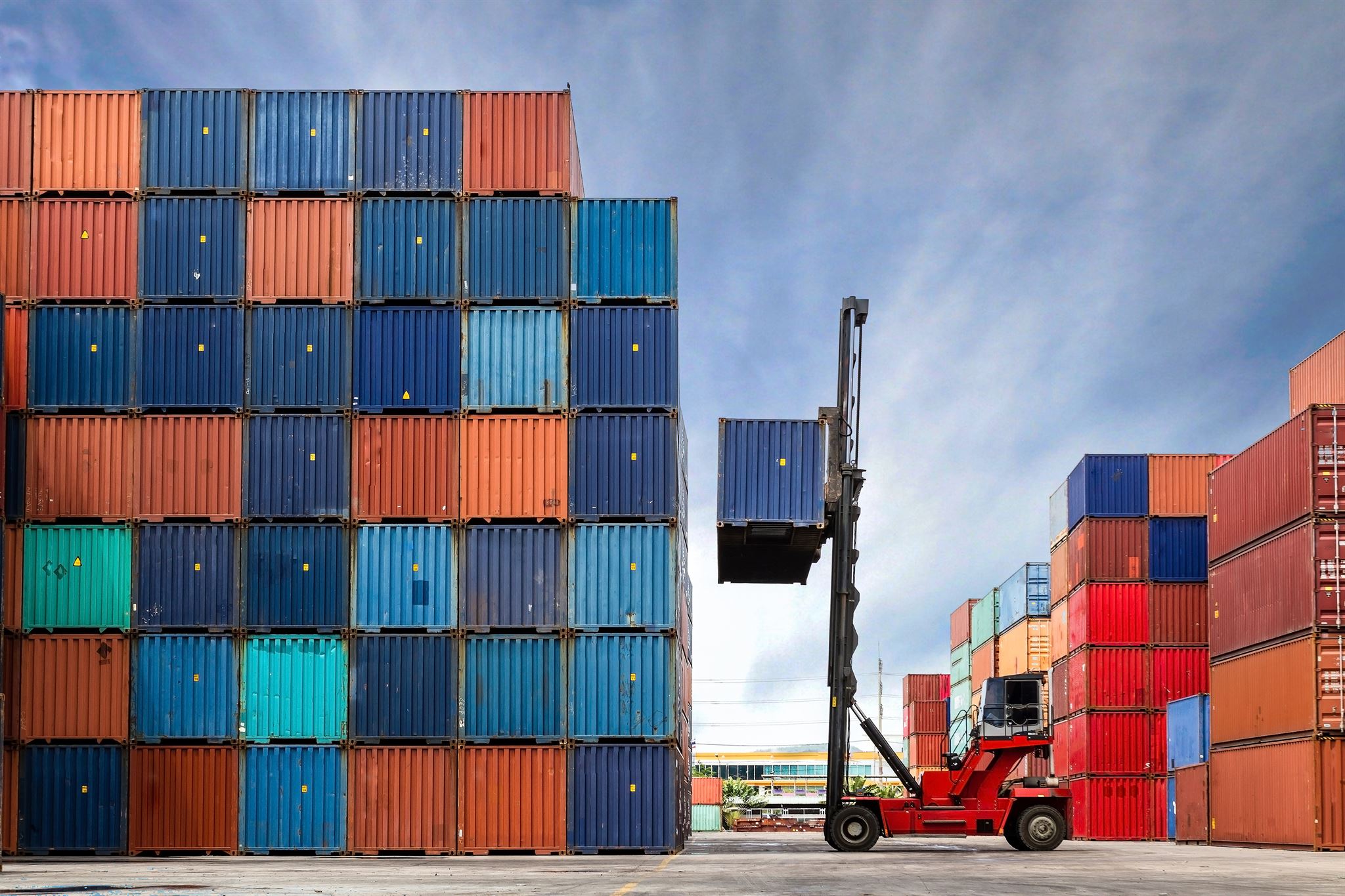 Container being loaded at shipping dock