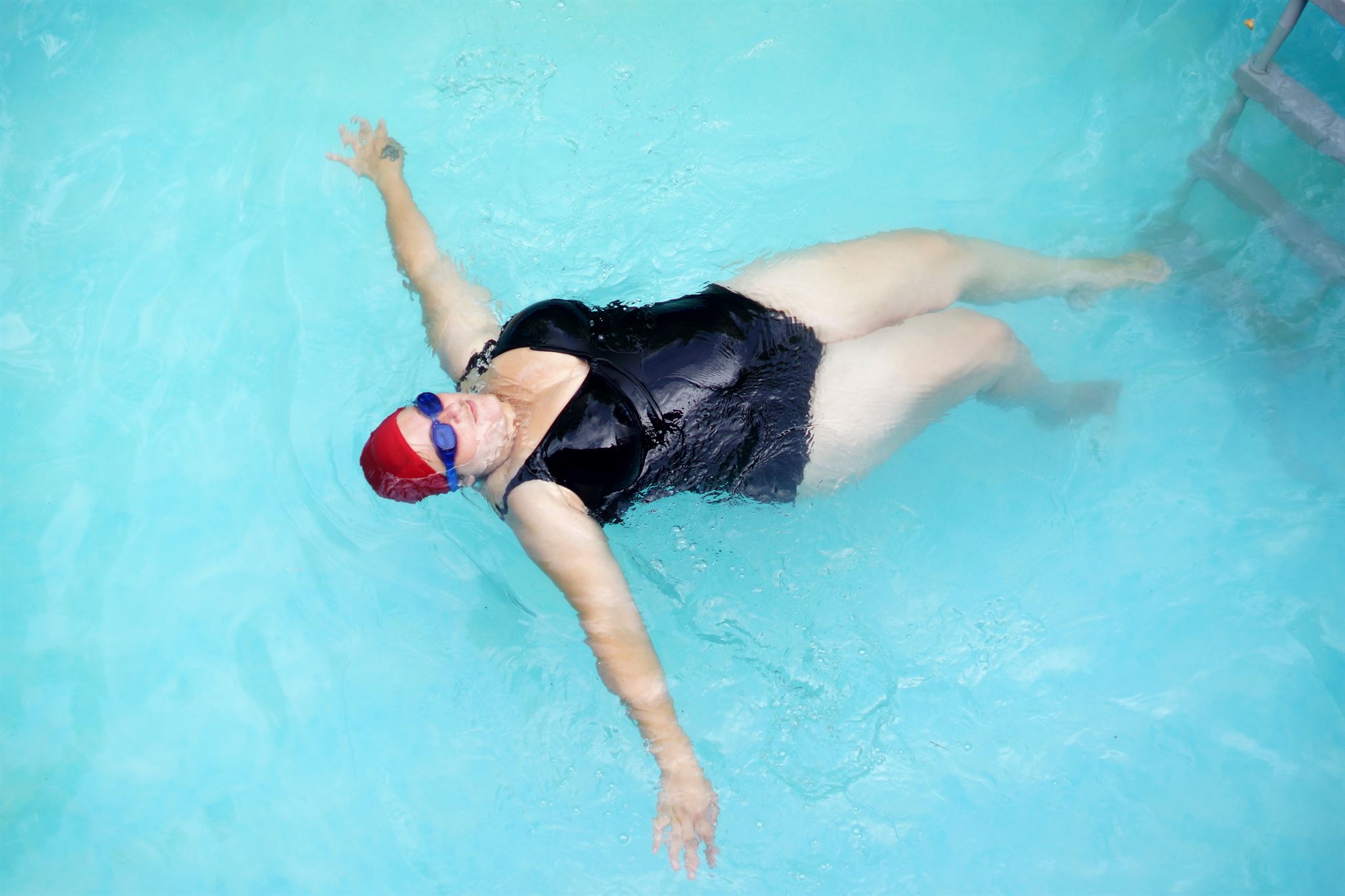 Adults participating in swim fitness class