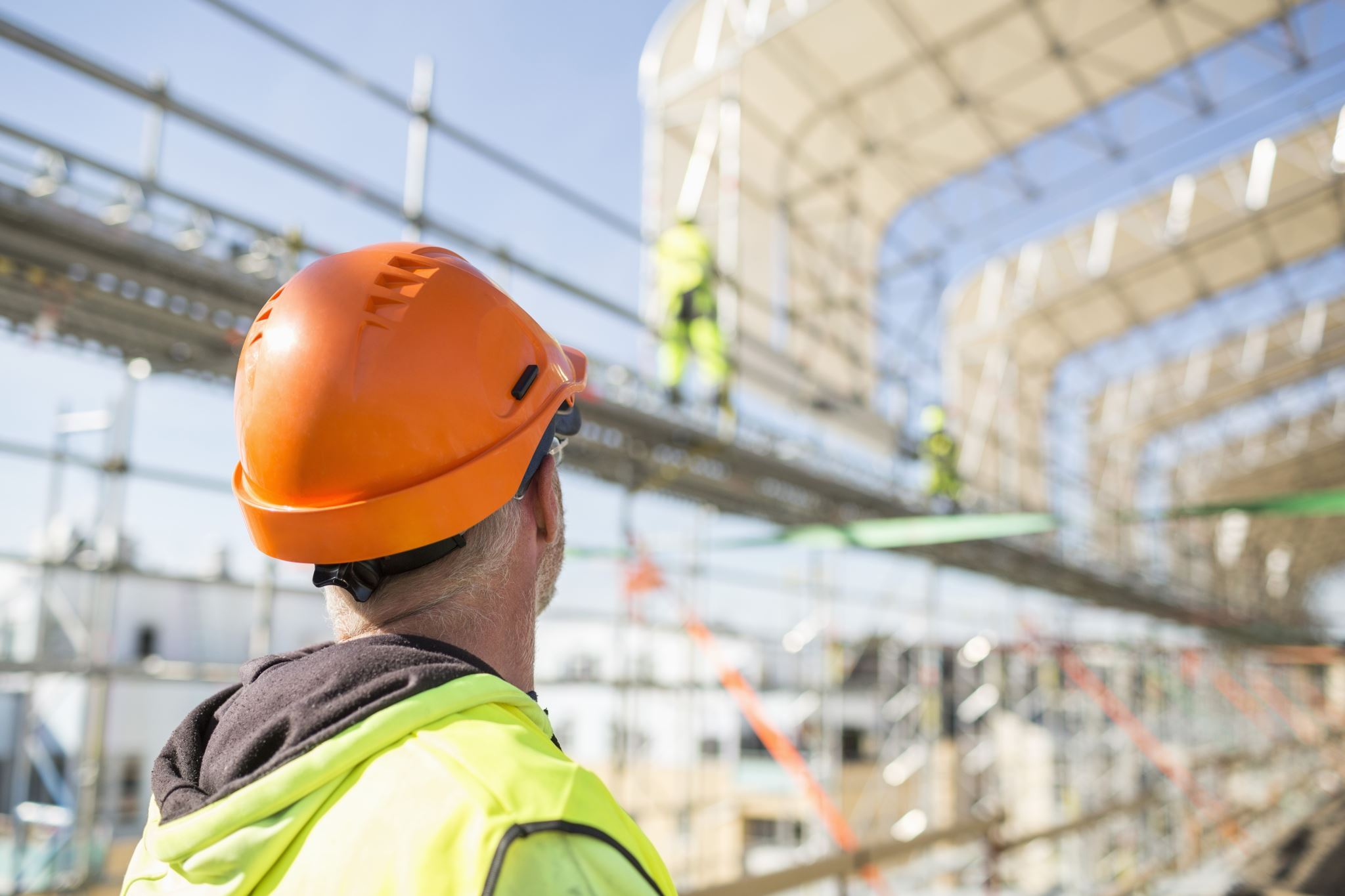Construction site with workers building facility