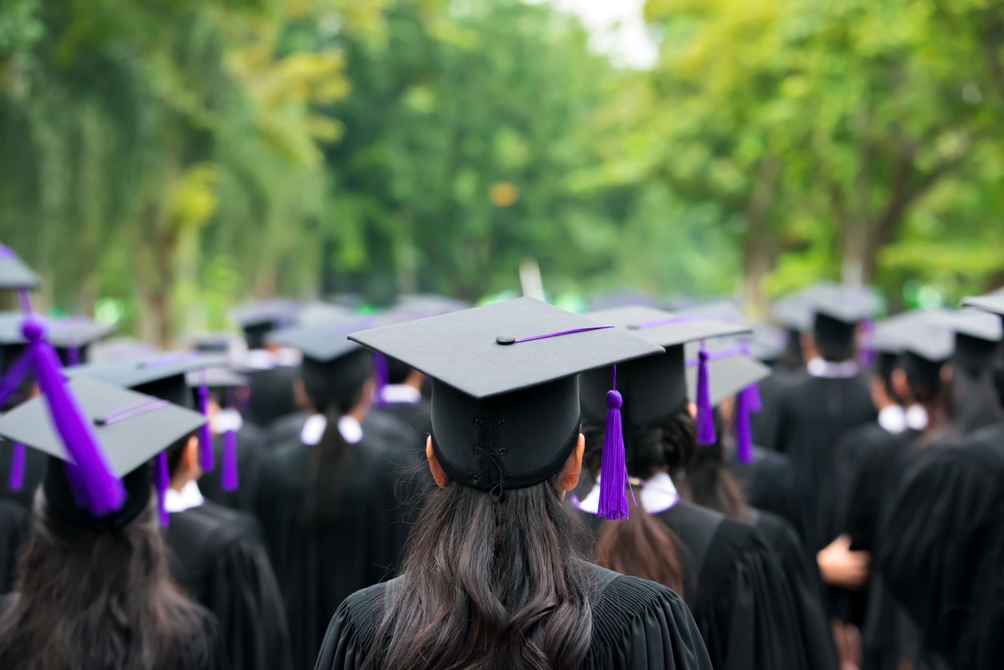 Graduation ceremony with graduates celebrating