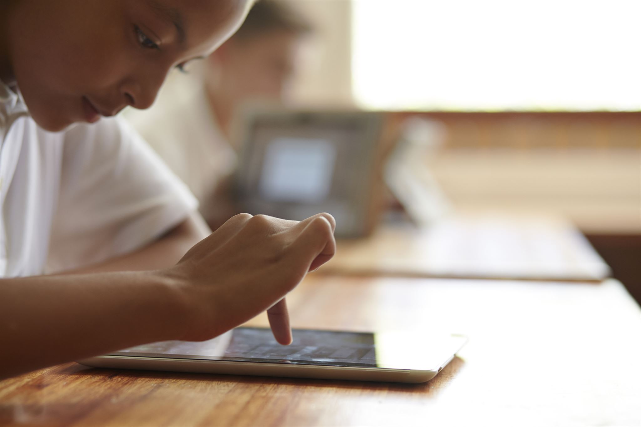 Student registering for courses on tablet