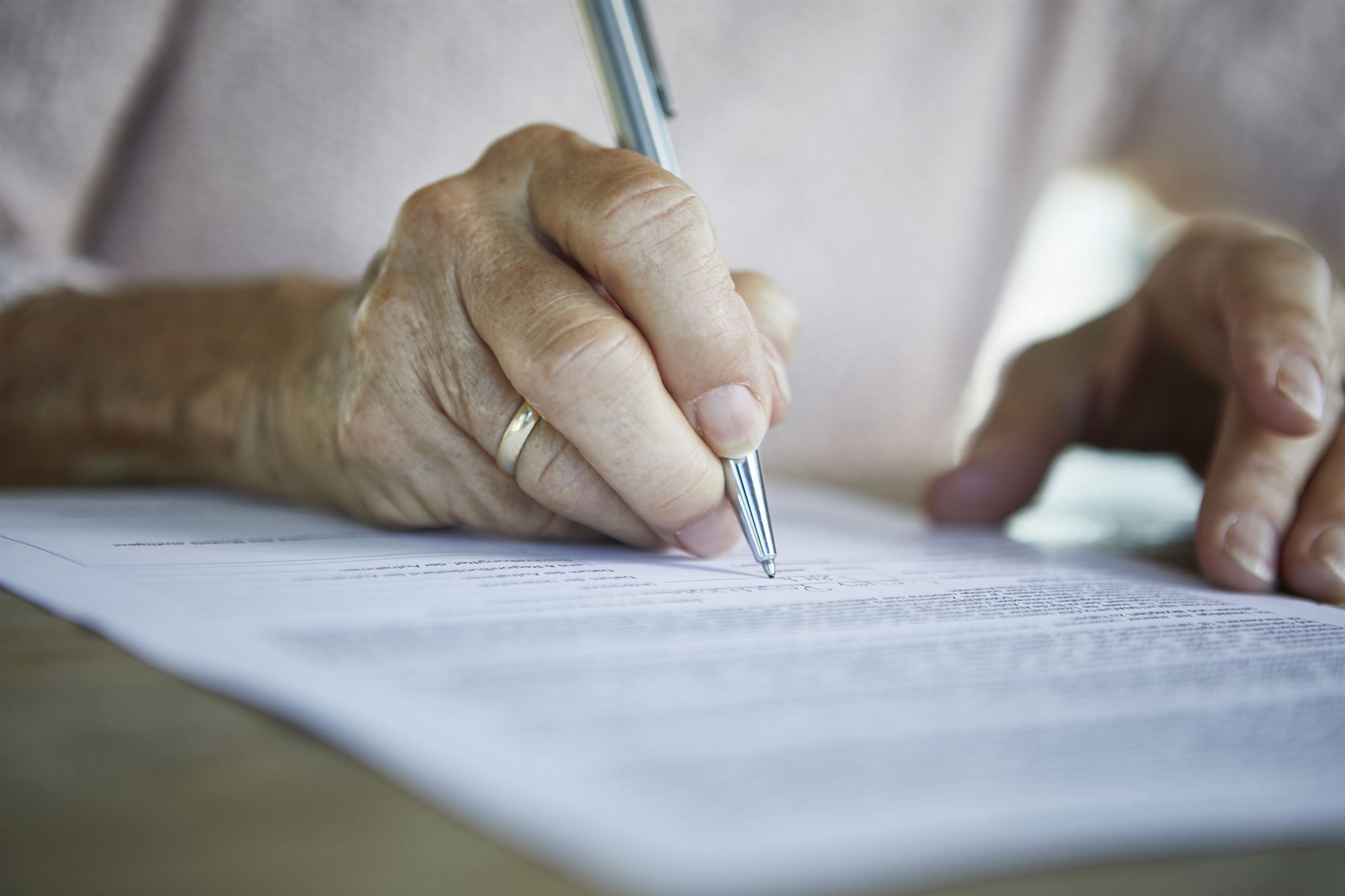 Tax agent reviewing documents on tablet